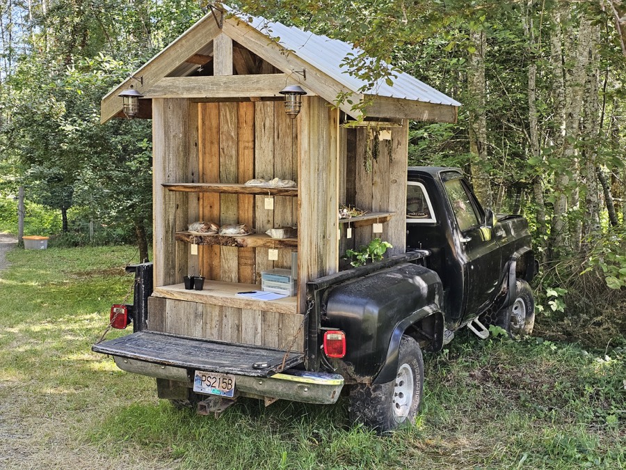 Farm stand produce displayed from the back of a truck